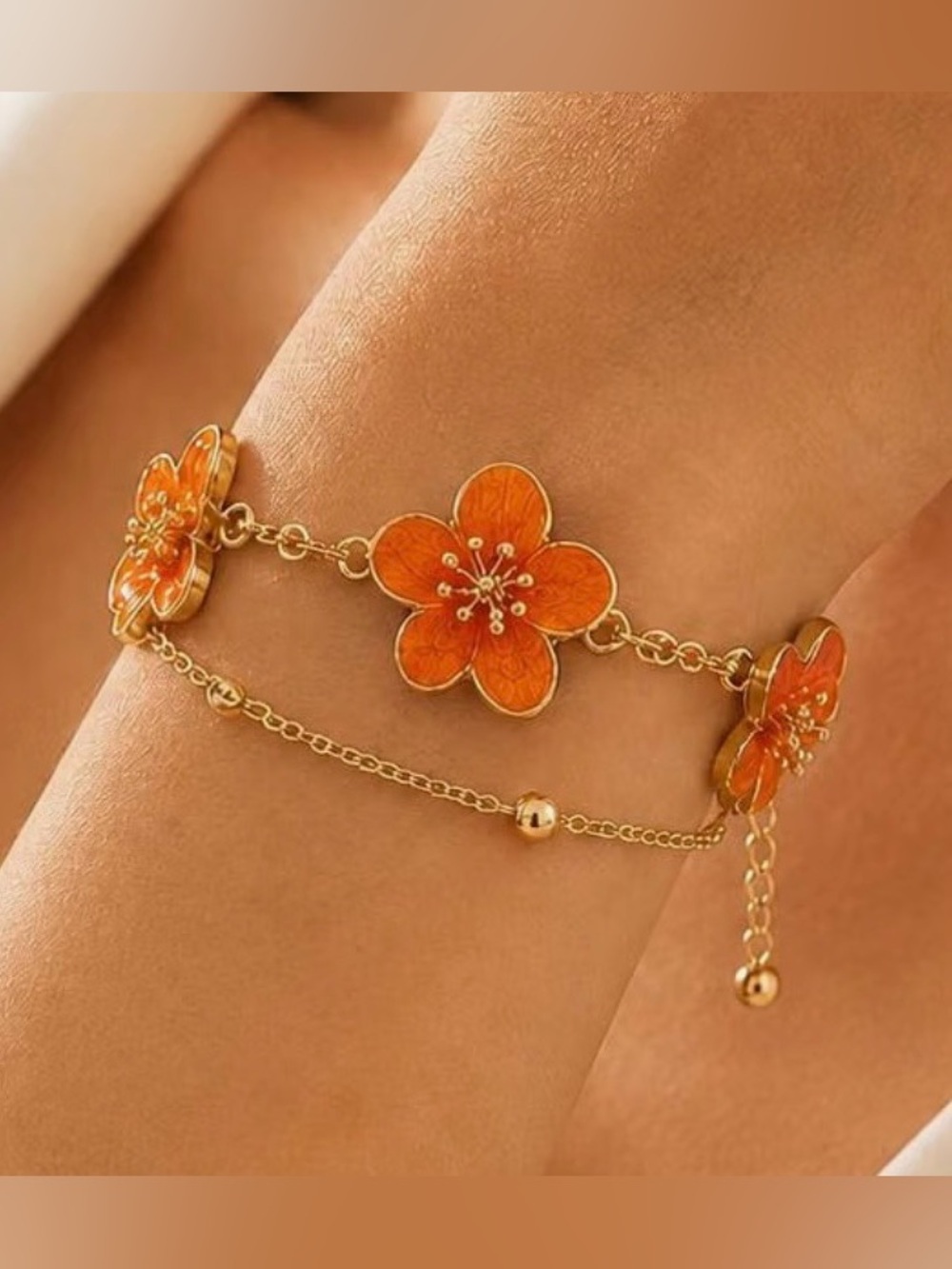 Gold-toned bracelet with orange flowers, NWT 🧡